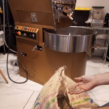Take It Easy Roasters - Barista getting green coffee beans ready to roast. - Bakeries Near Me - Las Vegas, Nevada Take It Easy Roasters - Barista getting green coffee beans ready to roast. - Bakeries Near Me - Las Vegas, Nevada