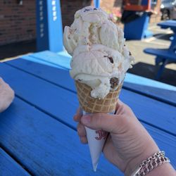 Small peanut butter cup ice cream in a waffle cone