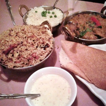 Swagat - West Madison - Left to right: tamarind rice with yogurt sauce, chicken madras with white rice, tail end of a gigantic dosa - Indian Near Me - Madison, Wisconsin