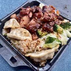 Ming Tree - Spicy bourbon chicken with fried rice, steamed veggies, and dumplings
