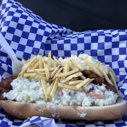 World Piece - The Picnic Basket hot dog; Mettwurst, maple bacon baked beans, creamy cole slaw, potato salad, topped with potato sticks.