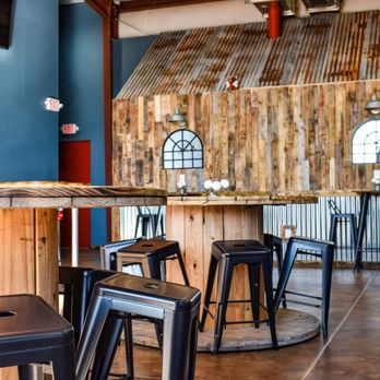 Bully Brewing - a view of a bar with stools - Breweries Near Me - Leesburg, Florida Bully Brewing - a view of a bar with stools - Breweries Near Me - Leesburg, Florida