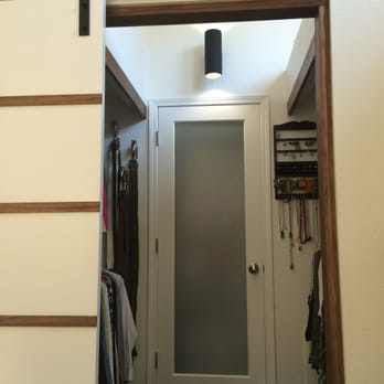 Ron Cohen - After photo, header with black walnut trim on jam and across closet ways. You can see the slider door to the left also trimmed in walnut - General Contractors Near Me - San Carlos, California