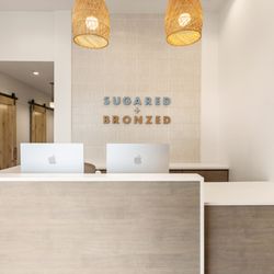 Sugared + Bronzed - SUGARED + BRONZED Huntington Beach reception desk