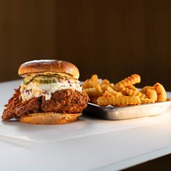 Twist Hot Chicken - TWIST HOT CHICKEN 
fried chicken in your choice of heat level, creamy coleslaw, twist sauce, dill pickles
