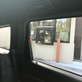 Dunkin' - On his phone while customers are waiting in line to order. - Donuts Near Me - Lutz, Florida Dunkin' - On his phone while customers are waiting in line to order. - Donuts Near Me - Lutz, Florida