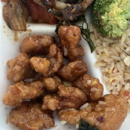 Tiny hard nuggets of orange chicken Tiny hard nuggets of orange chicken
