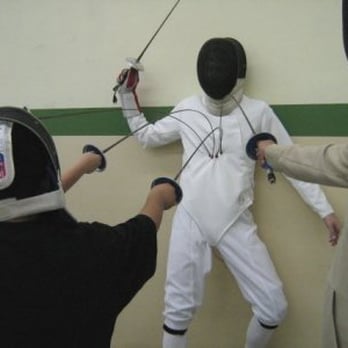Orange Coast Fencing Academy - After the foil demonstration at the spaghetti dinner, poor William is unceremoniously impaled by the excited participants. - Amateur Sports Teams Near Me - Fullerton, California Orange Coast Fencing Academy - After the foil demonstration at the spaghetti dinner, poor William is unceremoniously impaled by the excited participants. - Amateur Sports Teams Near Me - Fullerton, California