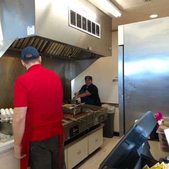 Blake's Lotaburger - A wonderful manager name Nora wearing a blue shirt. She is working the grill - Burgers Near Me - Albuquerque, New Mexico