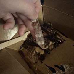 Whisky John's Bar & Grill - Paper we unraveled after a few bites into our cheesecake. (It was squished into the actual cake.) Big let down!