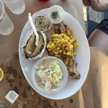 Waterman's Crab House - Grilled rockfish with coleslaw, mango slaw, and baked potato - Seafood Near Me - Rock Hall, Maryland Waterman's Crab House - Grilled rockfish with coleslaw, mango slaw, and baked potato - Seafood Near Me - Rock Hall, Maryland