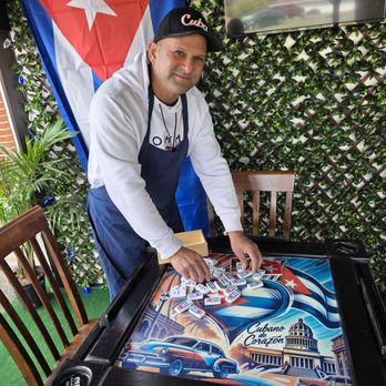 El Guajiro - The owner of the Cuban Food Truck showing off his beautiful, handcrafted Domino's table under the gazebo. - Cuban Near Me - Roanoke, Virginia El Guajiro - The owner of the Cuban Food Truck showing off his beautiful, handcrafted Domino's table under the gazebo. - Cuban Near Me - Roanoke, Virginia