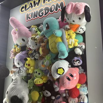 Claw Mania Kingdom - Claw mania picture wall. - Arcades Near Me - Houston, Texas