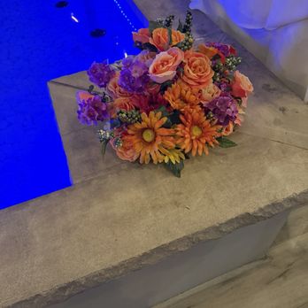 Catherine's Restaurant - Floral arrangements near the small pool -decorative. - Caribbean Near Me - Laurel, Maryland