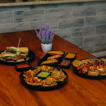 The Empanada Factory - a table of food - Latin American Near Me - Wake Forest, North Carolina