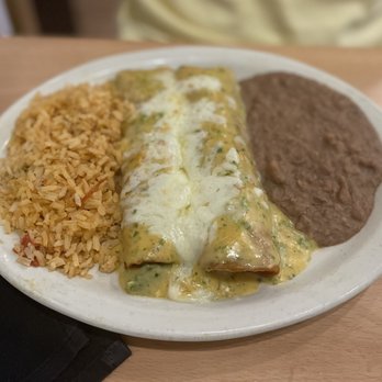 Manny’s Tex-Mex - Brisket enchiladas with sunset sauce! - Beer, Wine & Spirits Near Me - Sachse, Texas