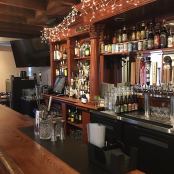 The Back Yard - a bar with a lot of bottles - Cocktail Bars Near Me - Baltimore, Maryland