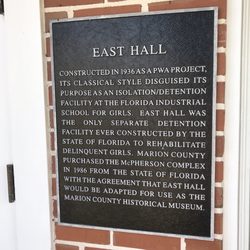 Marion County Museum of History and Archaeology - Plaque describing history of building.