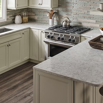 DeGeus Tile & Granite - a kitchen with white cabinets and countertops - Flooring Near Me - Rochester, Minnesota DeGeus Tile & Granite - a kitchen with white cabinets and countertops - Flooring Near Me - Rochester, Minnesota