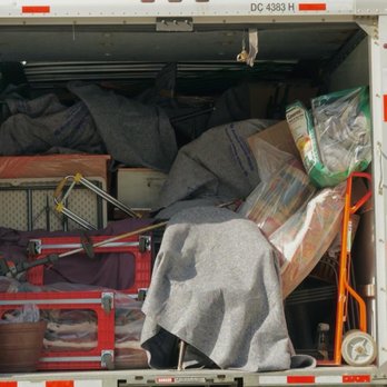 Octopus Movers Services - Carefully loading and securing a customer's belongings in their U-Haul for safe transportation. - Movers Near Me - Seattle, Washington Octopus Movers Services - Carefully loading and securing a customer's belongings in their U-Haul for safe transportation. - Movers Near Me - Seattle, Washington