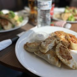 Inna's Pierogi Shop - Variety of mix and match with onions as a topping.