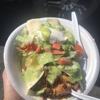 Anita's Taco's Truck - a hand holding a plate of food - Tacos Near Me - Okanogan, Washington Anita's Taco's Truck - a hand holding a plate of food - Tacos Near Me - Okanogan, Washington