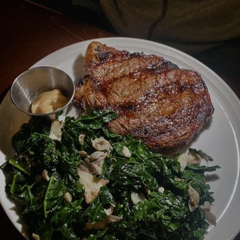 Six Hundredº - 14 oz. Ribeye Steak with Wilted Kale & Bone Marrow Butter - Steakhouses Near Me - Winston-Salem, North Carolina