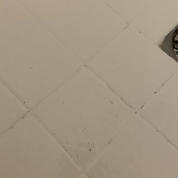 Merry Maids - Dirty water spots, shower floor - Home Cleaning Near Me - Granada Hills, California Merry Maids - Dirty water spots, shower floor - Home Cleaning Near Me - Granada Hills, California