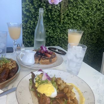 Sunny Side Cafe & Eatery - Eggs Benedict with Bacon instead of prosciutto, with potatoes (which was so good btw). Peach Bellini and Nutella waffles - Breakfast & Brunch Near Me - Miami Beach, Florida Sunny Side Cafe & Eatery - Eggs Benedict with Bacon instead of prosciutto, with potatoes (which was so good btw). Peach Bellini and Nutella waffles - Breakfast & Brunch Near Me - Miami Beach, Florida