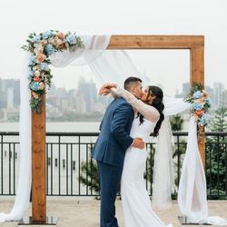 Monmouth Wedding Rentals - Modern wood beam arch, silk florals and drapery.