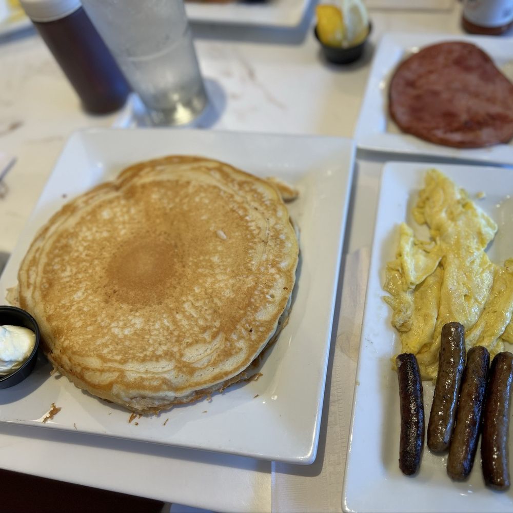 Keke's Breakfast Cafe - My friend's meal - three LARGE pancakes, 4 sausage links and scrambled eggs. - Breakfast & Brunch Near Me - Jacksonville, Florida Keke's Breakfast Cafe - My friend's meal - three LARGE pancakes, 4 sausage links and scrambled eggs. - Breakfast & Brunch Near Me - Jacksonville, Florida