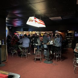 a large group of people sitting at tables a large group of people sitting at tables