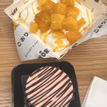 KŌRI Bakery & Dessert - Mango golden cake and a strawberry chocolate cheesecake - Desserts Near Me - Orlando, Florida