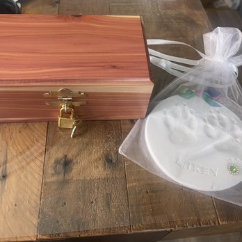 Rainbow Bridge Pets Cremations - Included with the cremation was a beautiful cedar box and a paw print of our Mikey. - Pet Cremation Services Near Me