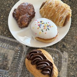 Apple fritter, almond croissant, eclair, raspberry filled donut