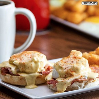 State & Main Kitchen & Bar - two eggs benedicts on a plate - Bars Near Me - Airdrie, Alberta State & Main Kitchen & Bar - two eggs benedicts on a plate - Bars Near Me - Airdrie, Alberta