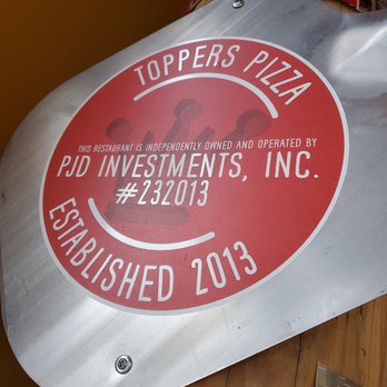 Toppers Pizza - a close up of a sign - Pizza Near Me - Winona, Minnesota Toppers Pizza - a close up of a sign - Pizza Near Me - Winona, Minnesota