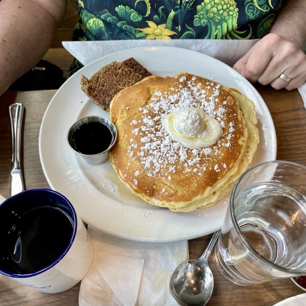 Toast & Berry - Fuffy buttermilk pancakes with whipped butter, light powdered sugar, a maple syrup, with a side of goetta included - Breakfast & Brunch Near Me - Montgomery, Ohio Toast & Berry - Fuffy buttermilk pancakes with whipped butter, light powdered sugar, a maple syrup, with a side of goetta included - Breakfast & Brunch Near Me - Montgomery, Ohio