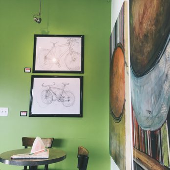 Izzy's Bagel - Seating area and local art for sale on the wall - Bagels Near Me - Bedford, Nova Scotia Izzy's Bagel - Seating area and local art for sale on the wall - Bagels Near Me - Bedford, Nova Scotia