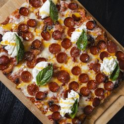 Florenza - Roman-style pizza topped with cup-and-char pepperoni, creamy burrata and hot honey on a light, airy crust.