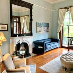 The Lanaux Mansion - Ruthie's Balcony Suite features a spacious living area, newly redecorated private bathroom, and a large, sunny kitchenette