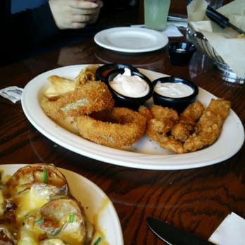 T-BONES Great American Eatery - Onion rings and buffalo chicken tender part of appetizer sampler ($13.99) - American Near Me - Laconia, New Hampshire T-BONES Great American Eatery - Onion rings and buffalo chicken tender part of appetizer sampler ($13.99) - American Near Me - Laconia, New Hampshire