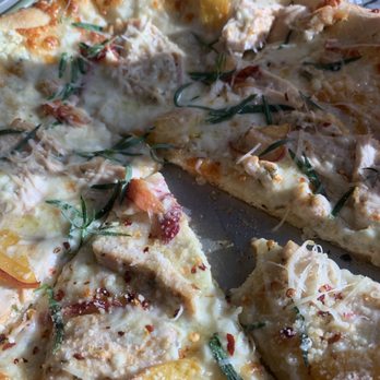 Bridge Pizza - One of the daily specials, white sauce with chicken, bacon, fresh peaches, gorgonzola and tarragon. - Italian Near Me - Missoula, Montana Bridge Pizza - One of the daily specials, white sauce with chicken, bacon, fresh peaches, gorgonzola and tarragon. - Italian Near Me - Missoula, Montana
