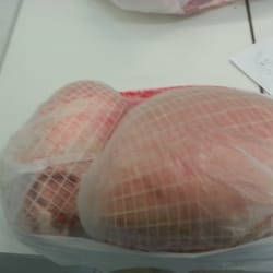 Ashcroft Meats - Big awesome pork and lamb shoulders next to each other.