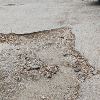 Merit Coffee - Huge pothole in parking lot - Coffee & Tea Near Me - Austin, Texas Merit Coffee - Huge pothole in parking lot - Coffee & Tea Near Me - Austin, Texas
