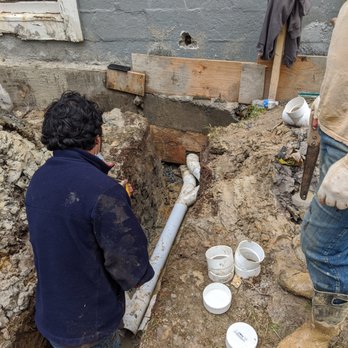 Pipe & Stone - two men working on a construction project - Waterproofing Near Me - Silver Spring, Maryland