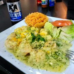 Culichi Shrimp.. Shrimp sauteed W/ garlic green sauce, melted cheese. Rice and salad.   I asked for corn tortilla on the side.   its