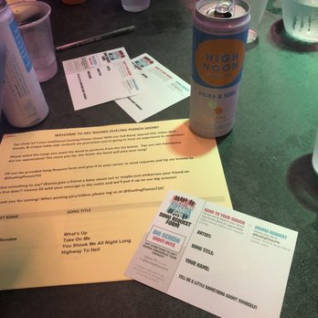 Rec Room - a can of soda and some papers on a table - Dance Clubs Near Me - Buffalo, New York