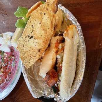 Mopho - Po mi sandwich with crispy chicken vindaloo - very spicy and yummy - Vietnamese Near Me - New Orleans, Louisiana