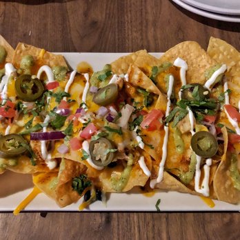 Eureka! - Chicken nachos with black beans, an avocado tomatillo sauce, and a chipotle sauce. // @thesoutherndish - American Near Me - Austin, Texas Eureka! - Chicken nachos with black beans, an avocado tomatillo sauce, and a chipotle sauce. // @thesoutherndish - American Near Me - Austin, Texas
